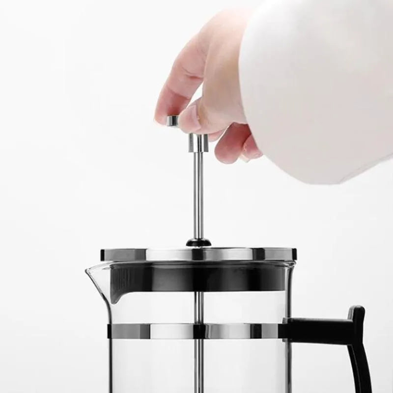 Compact stainless steel and glass drip coffee maker with 350ml capacity.