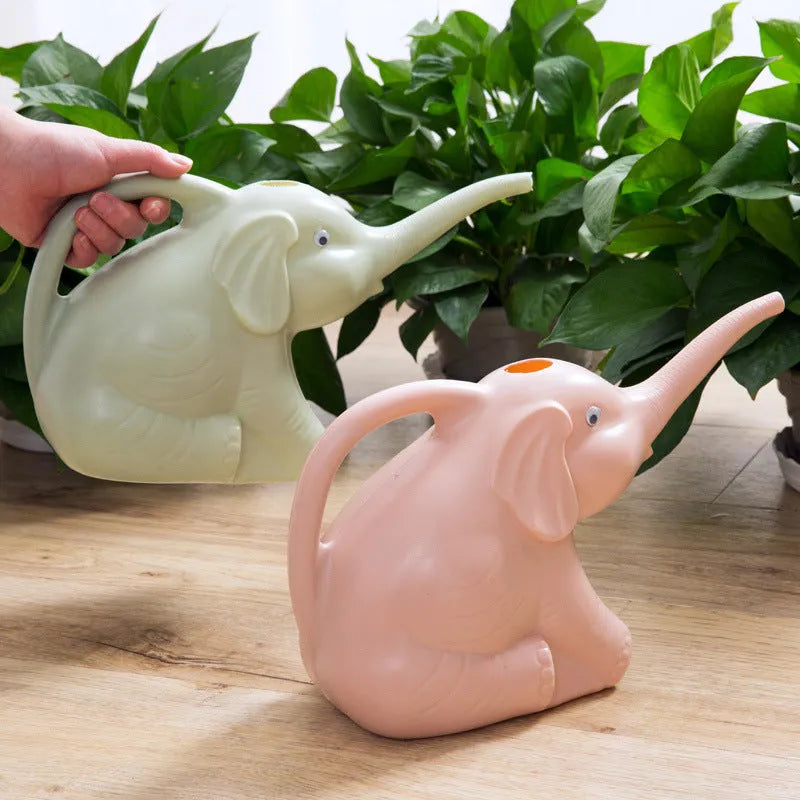 Pink elephant-shaped children's watering can with long nozzle and baby bottle handle.