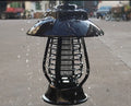 Black solar-powered mosquito lamp with solar panel and LED lights for garden insect control