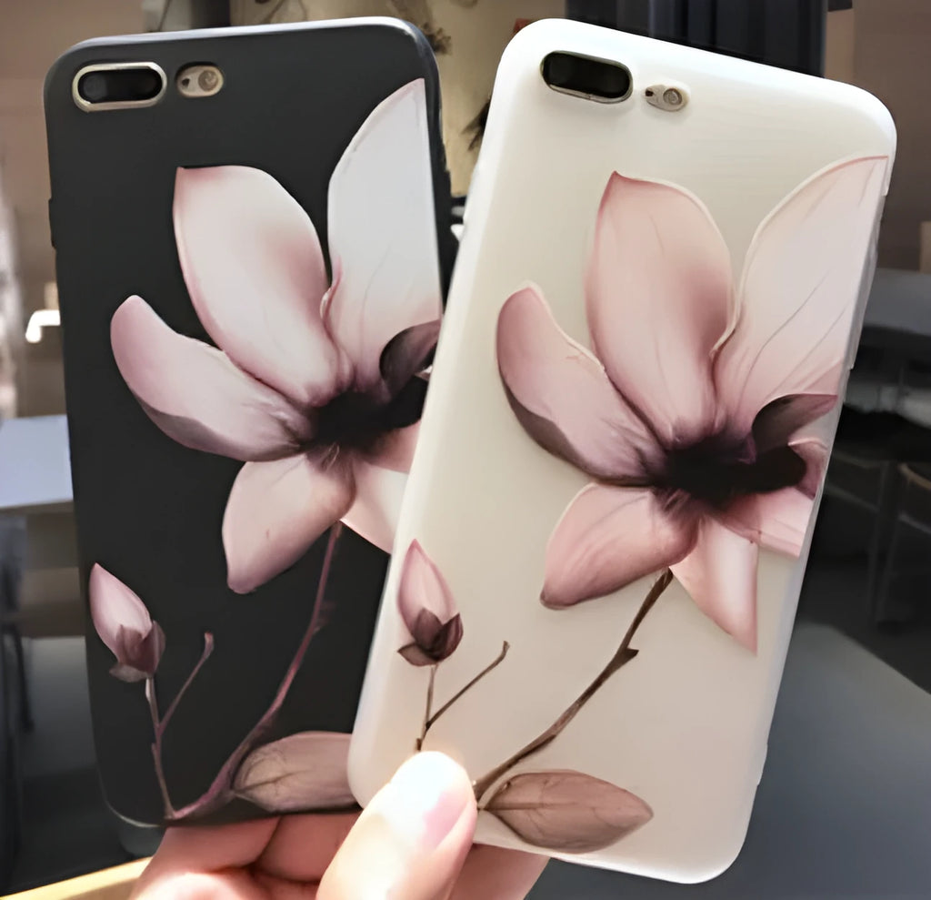Slim black iPhone case with a single raised embossed flower design on the back.