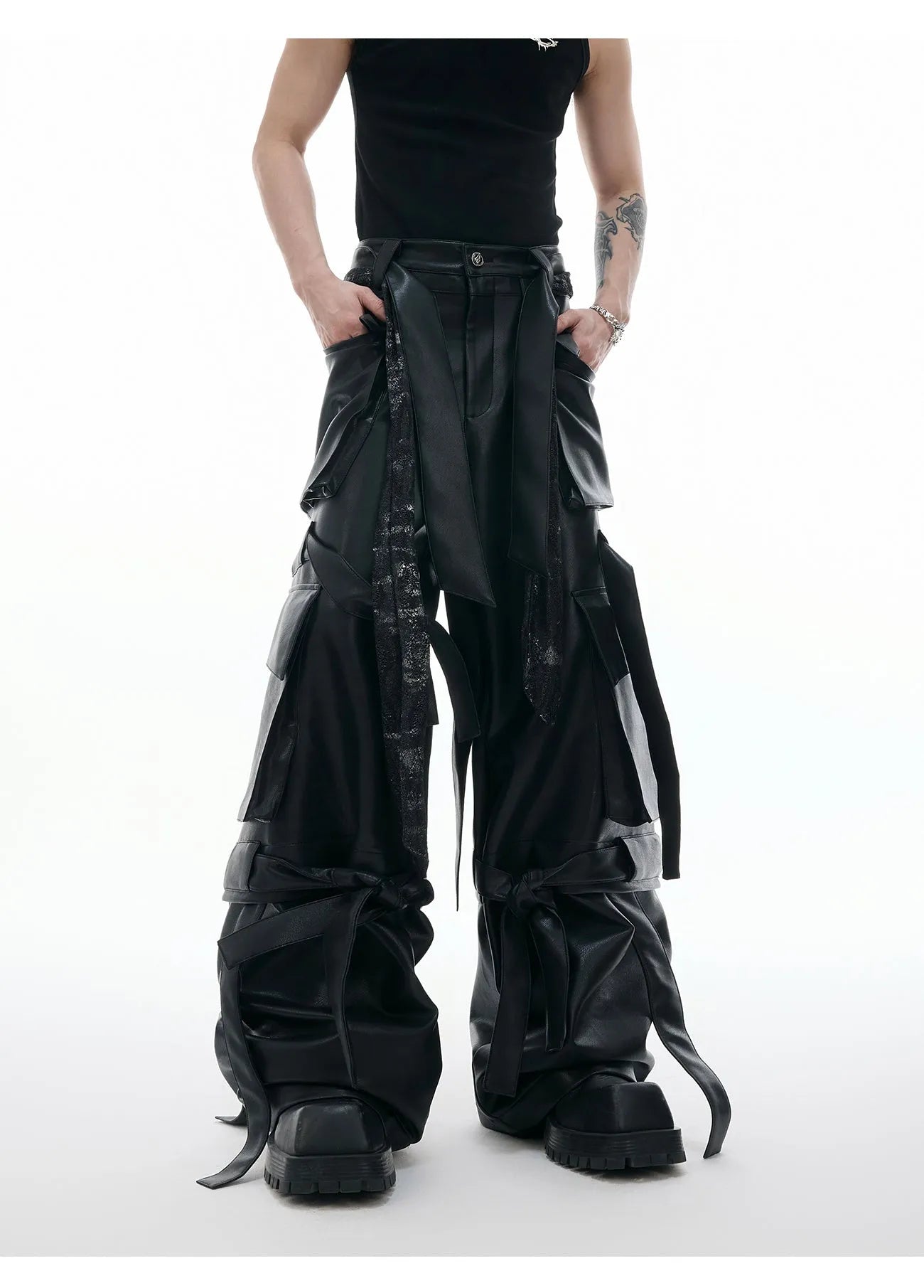 Black loose fit leather pants with multiple pockets and quilted stitching detail