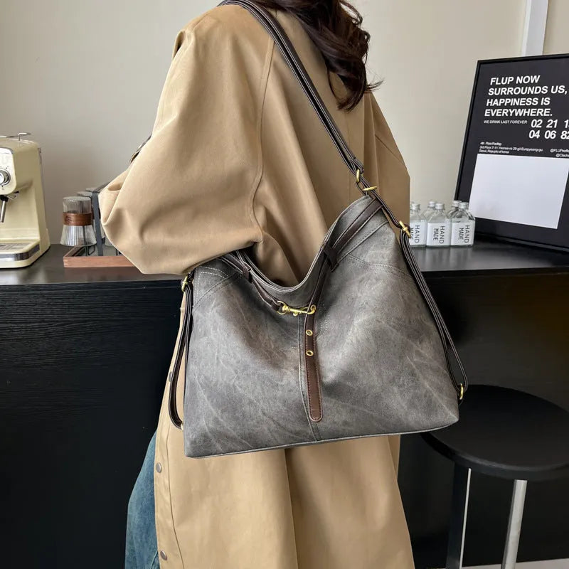 Retro large capacity PU tote bag in black with double shoulder straps and sewing line detail