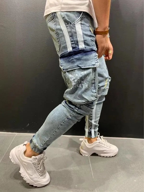 Men's denim knee-cut zipper trousers in black, front view, showing zipper placket and relaxed fit