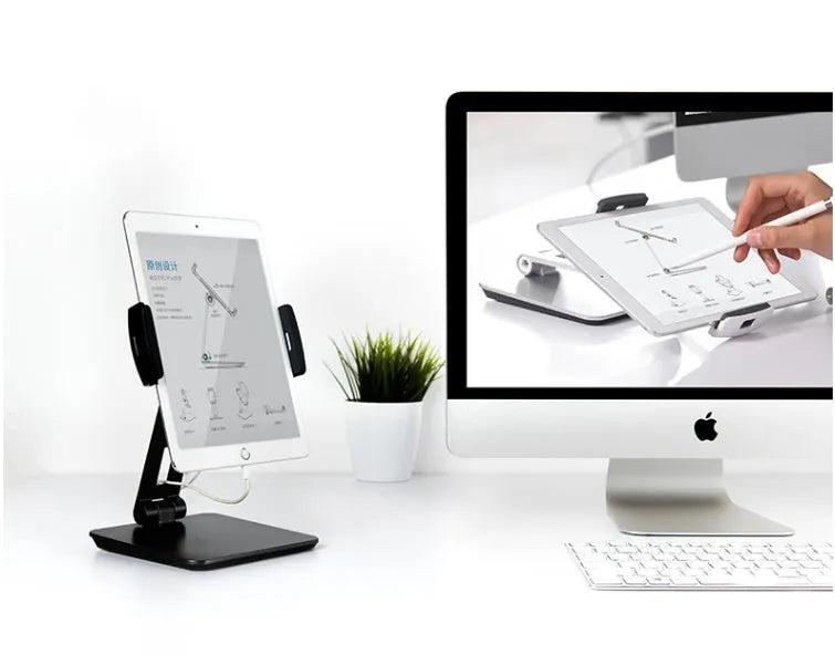 Black folding phone tablet holder with 360° rotating head on desktop