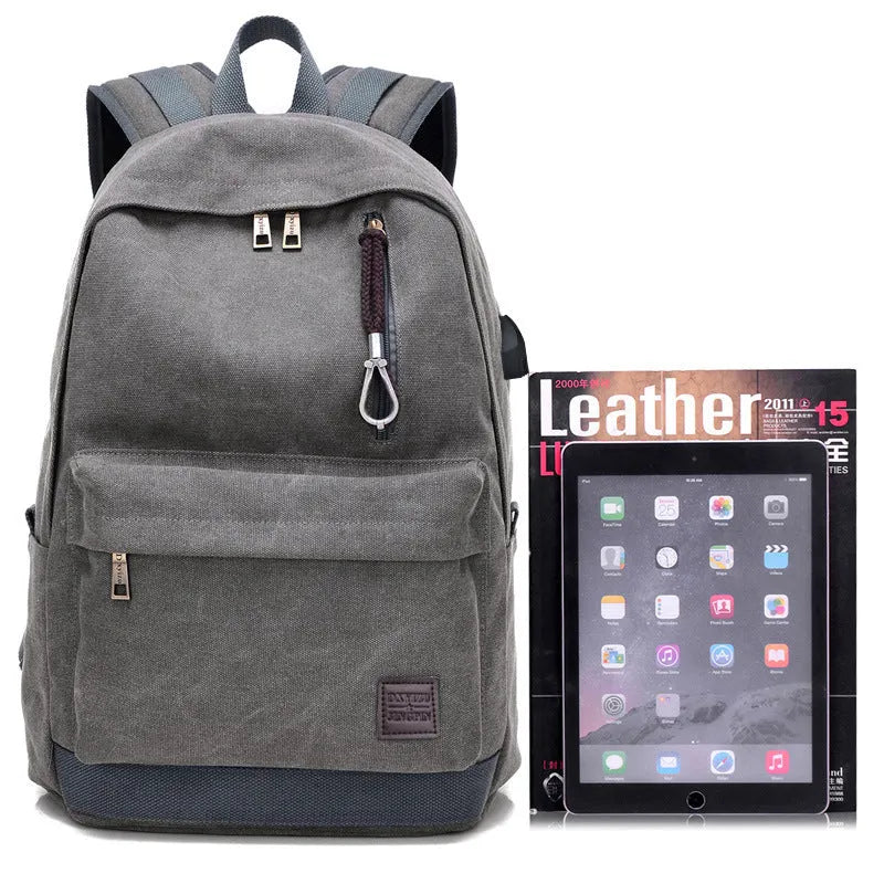 Canvas backpack with USB charging port shown in coffee colour, featuring a laptop compartment and multiple pockets.