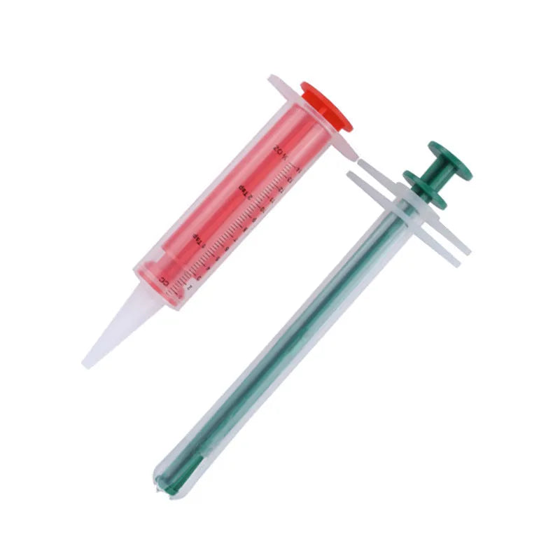 Two silicone pet pill shooters with soft tips, one larger and one smaller, for administering tablets to cats and dogs.