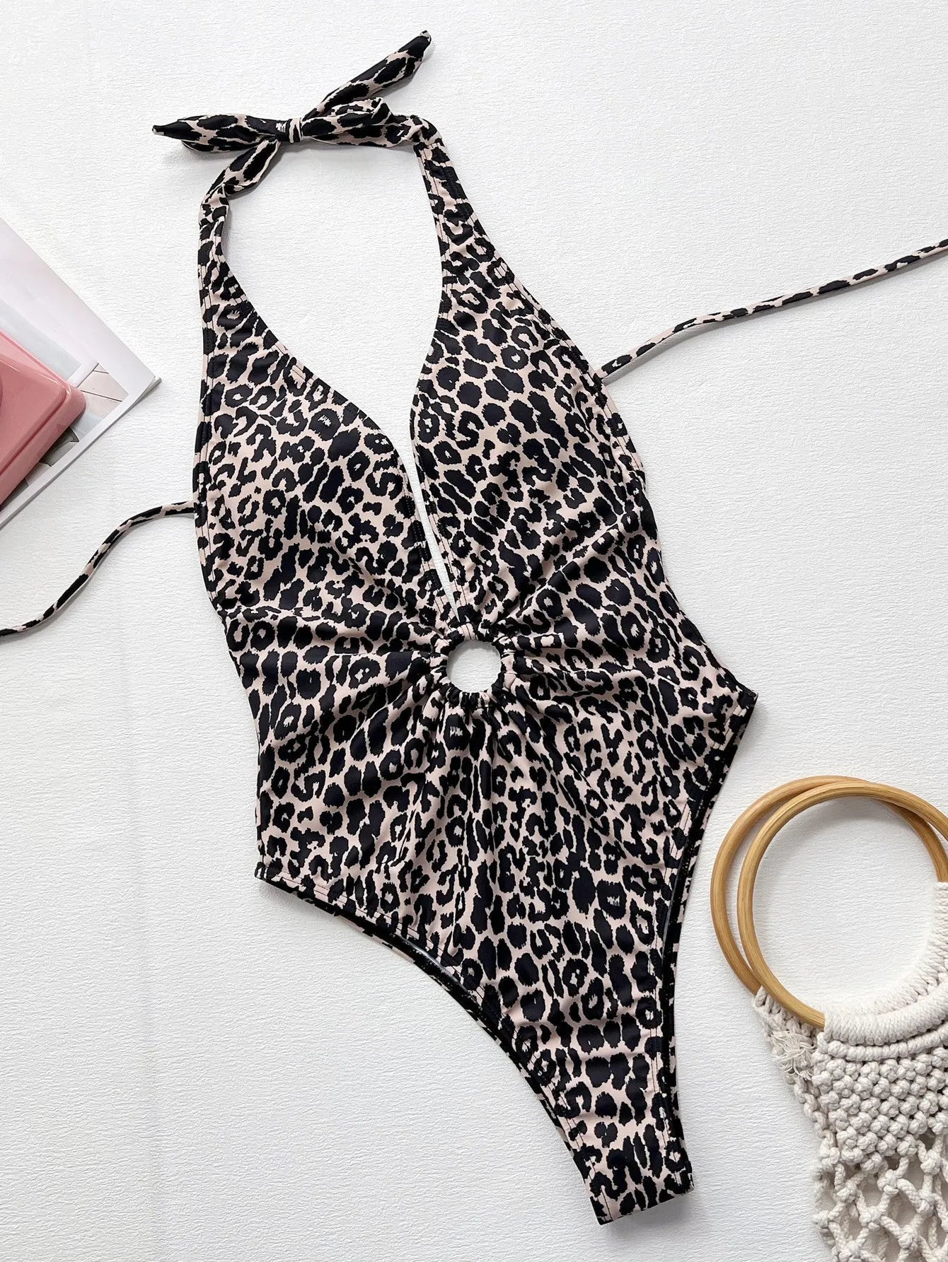 Leopard print one-piece swimsuit for women with hollow-out ring pattern detail.