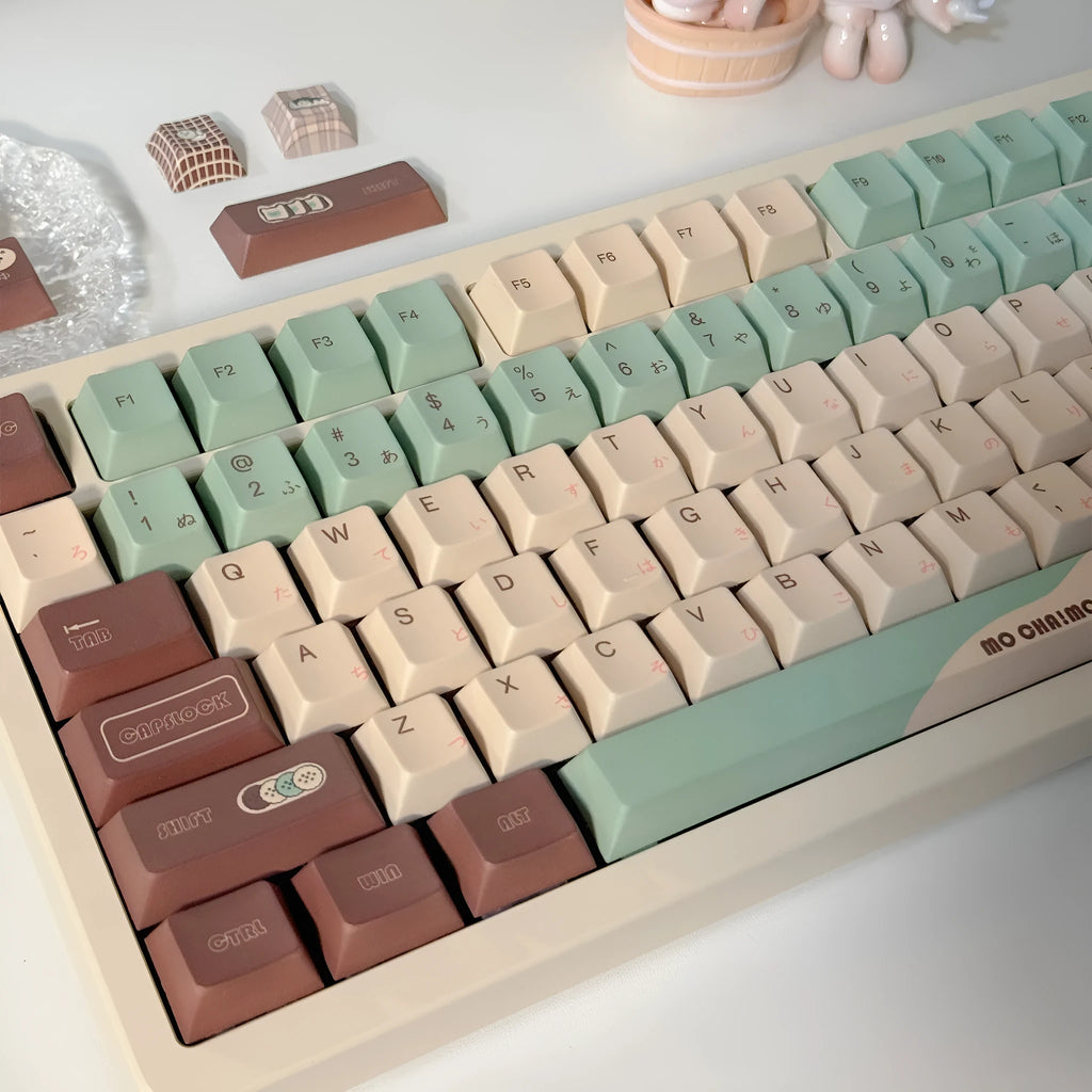 Matcha green theme mechanical keyboard keycaps with ergonomic CAP adaptive shafts on a white background.