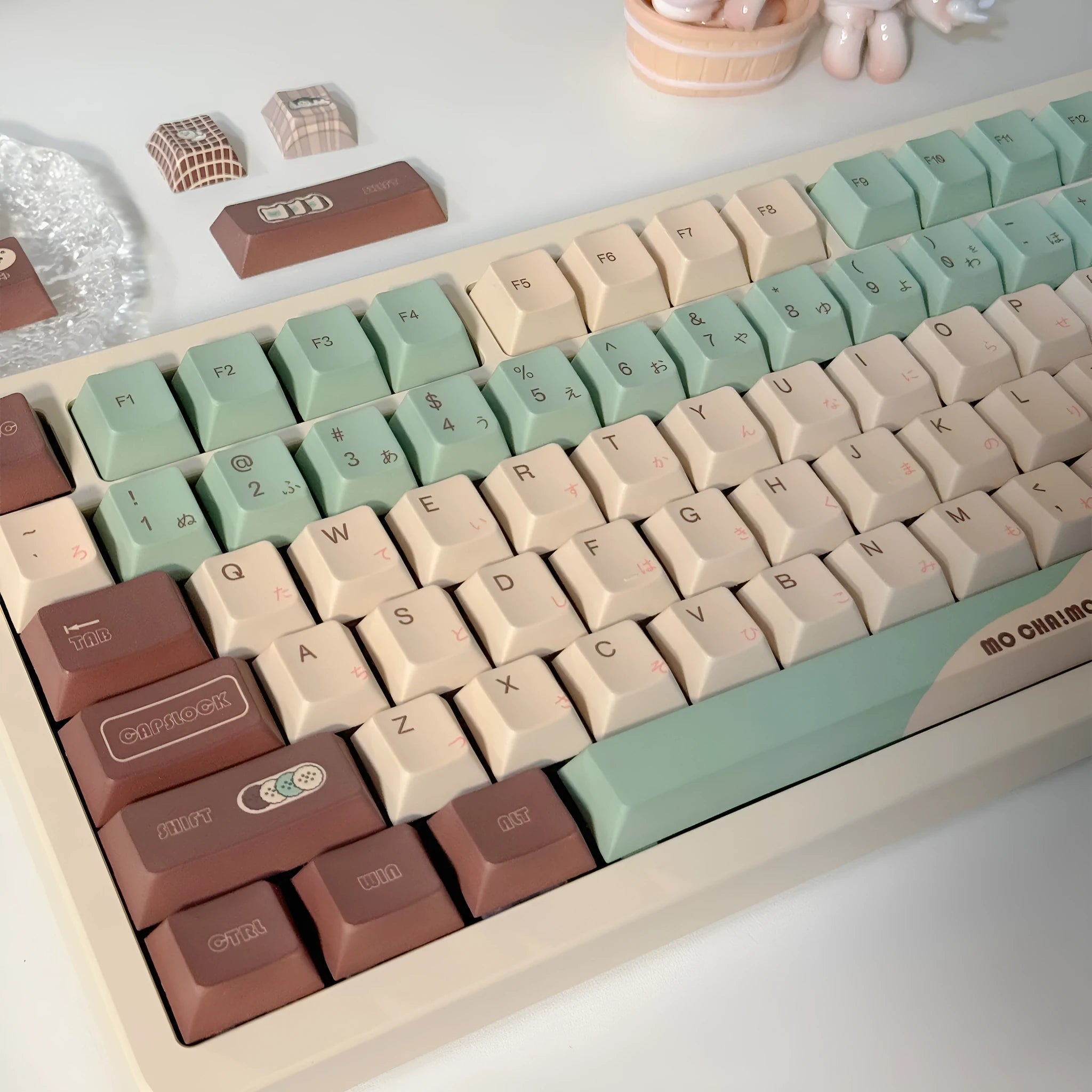 Matcha green theme mechanical keyboard keycaps with ergonomic CAP adaptive shafts on a white background.