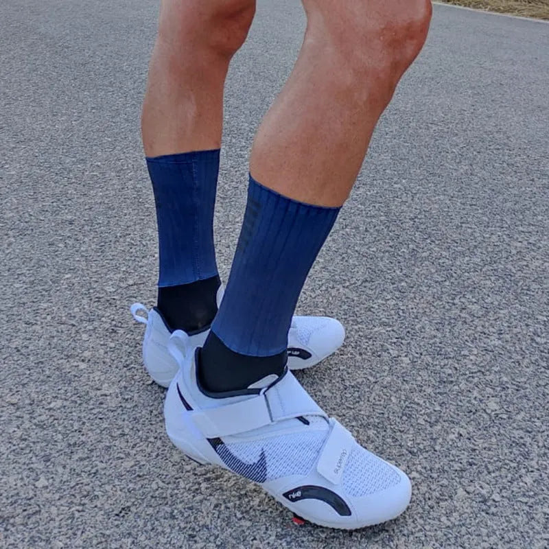 A pair of breathable athletic sports socks for cycling and running, shown in one of six available colours.