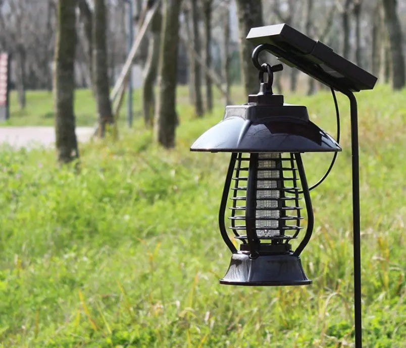 Black solar-powered mosquito lamp with solar panel and LED lights for garden insect control