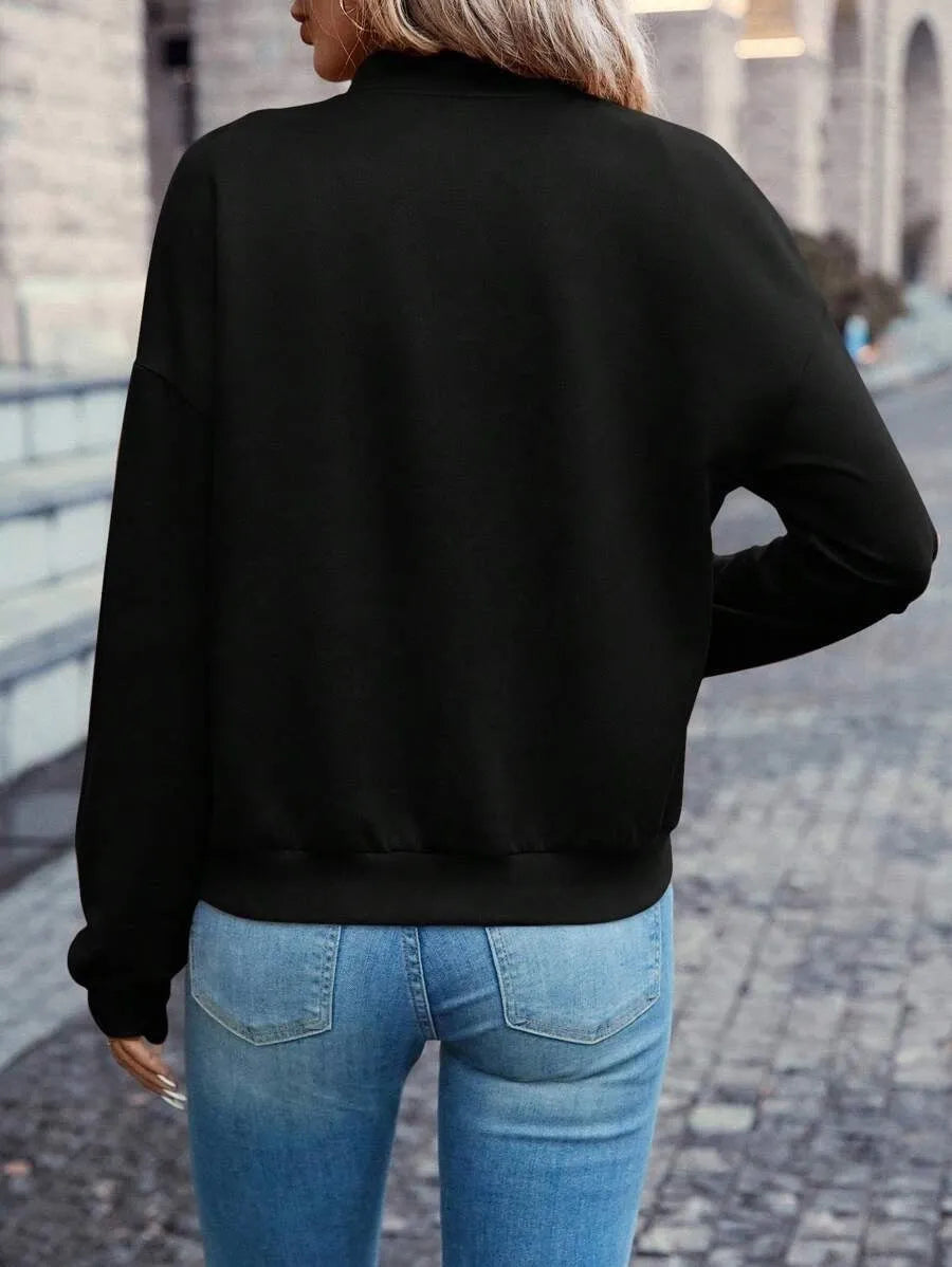 Women's black zip jacket with long sleeves and faux pocket design