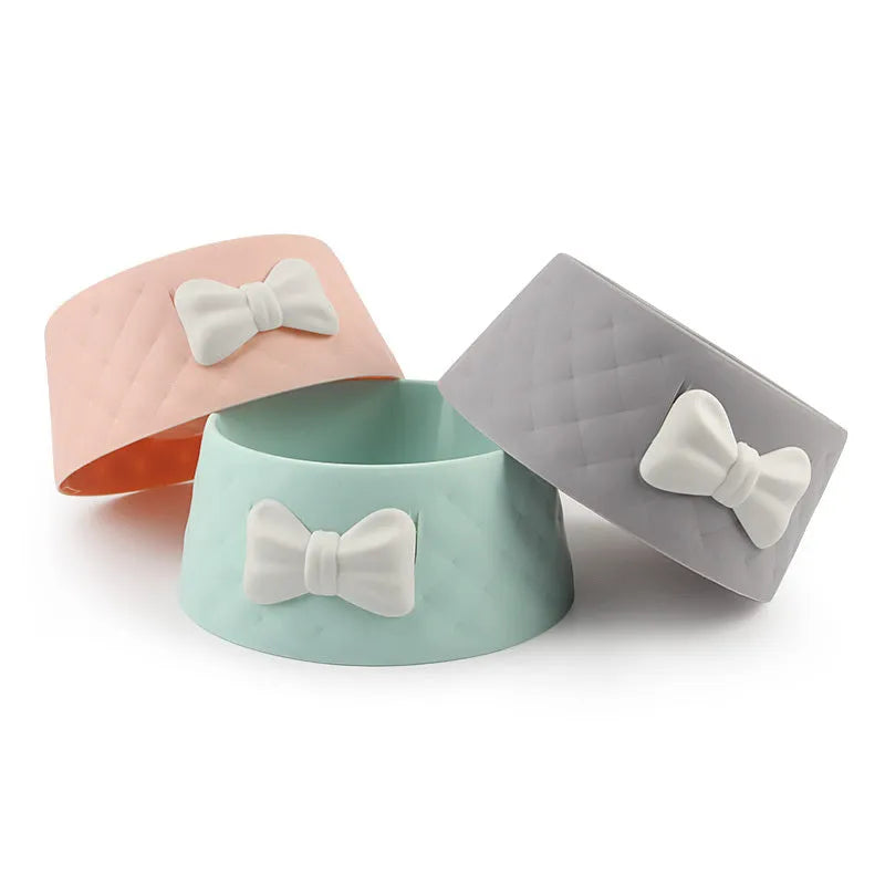 Bow design cat and dog bowl in PP plastic available in pink green and grey colours