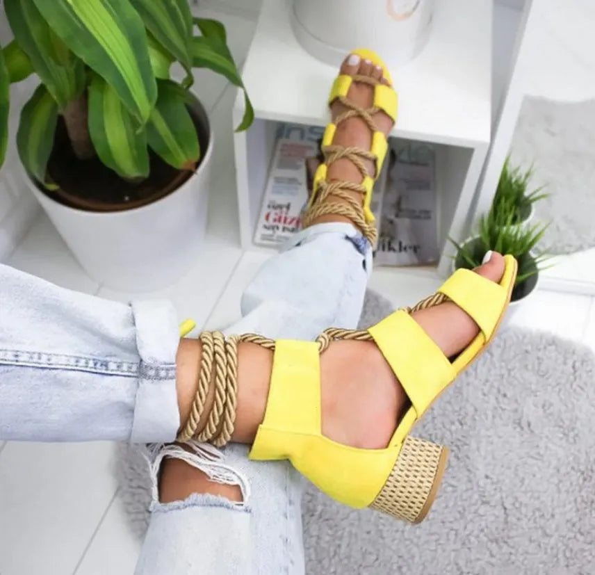 Women's beige suede sandals with thick matching heels and front strap design