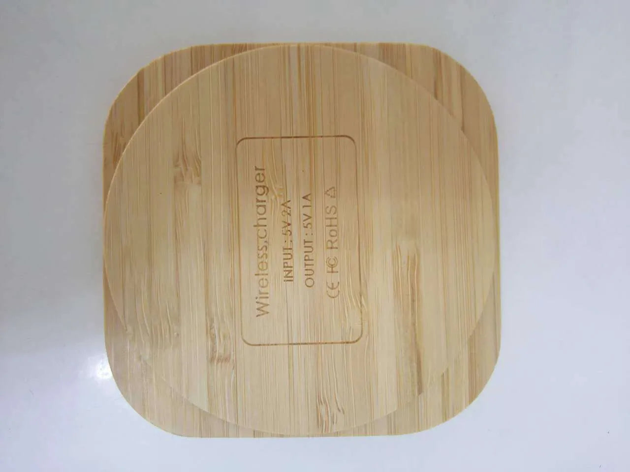 Square brown wooden bamboo 5W Qi wireless charging pad showing dimensions.