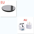 Black coffee mug warmer with temperature control dial on desk