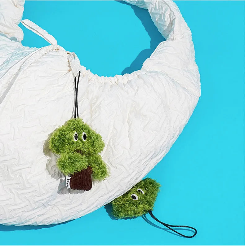 Pine tree-shaped cat mint toy bag pendant and a separate cat tease stick on a white background