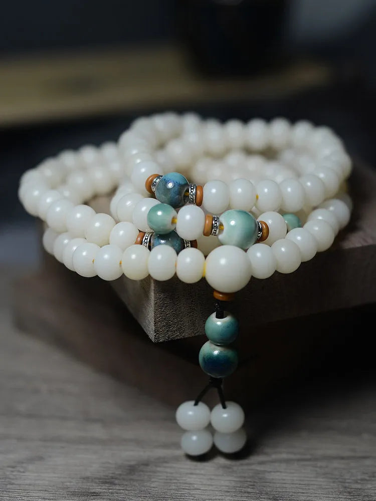 White bodhi seed bracelet with 108 flat round beads in two sizes