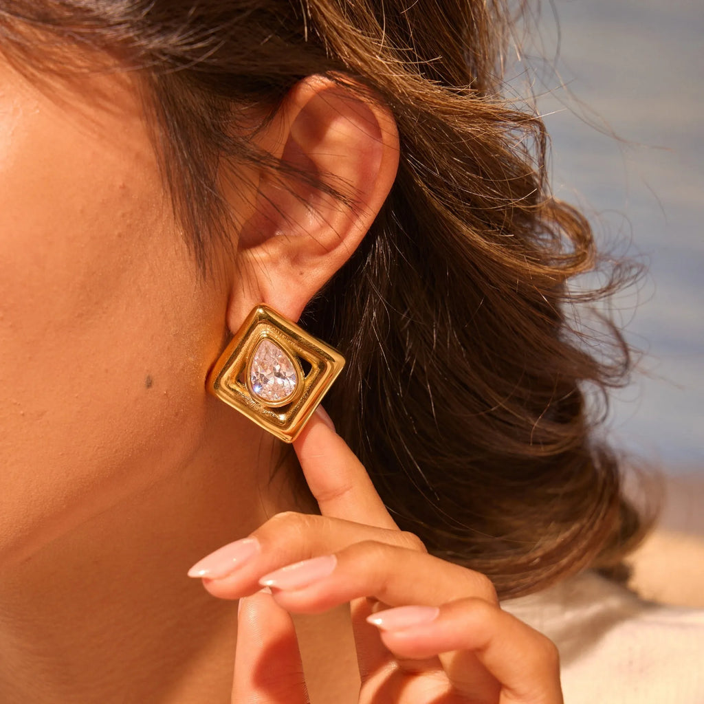 Geometric water drop shaped stud earrings with inlaid zircon stone and gold colour finish