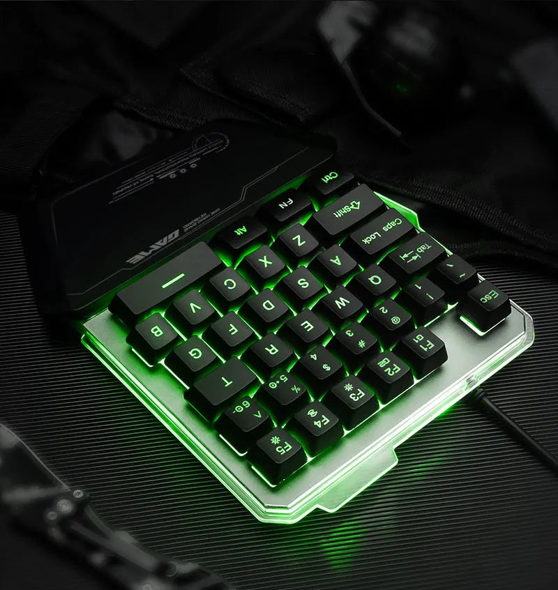 G40 black one-handed mechanical keyboard with RGB backlit keys on a desk.