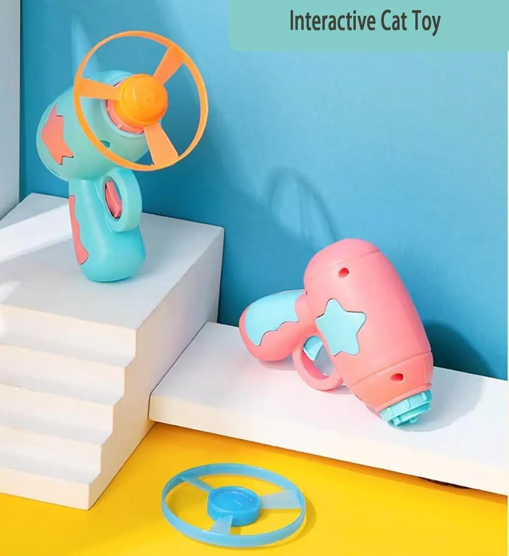 Blue or pink plastic cat toy gun with two Frisbee discs for indoor play.