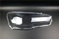 Transparent plastic headlight housing cover measuring 50mm by 30mm by 20mm