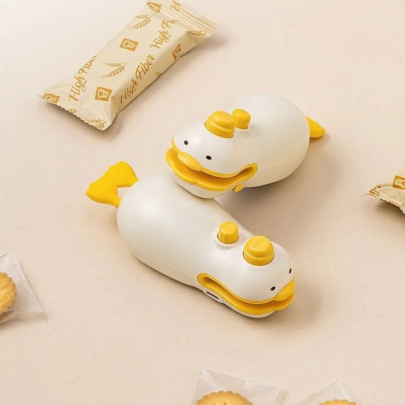 Yellow duck-shaped rechargeable sealing machine with animal jacquard pattern and charging cable