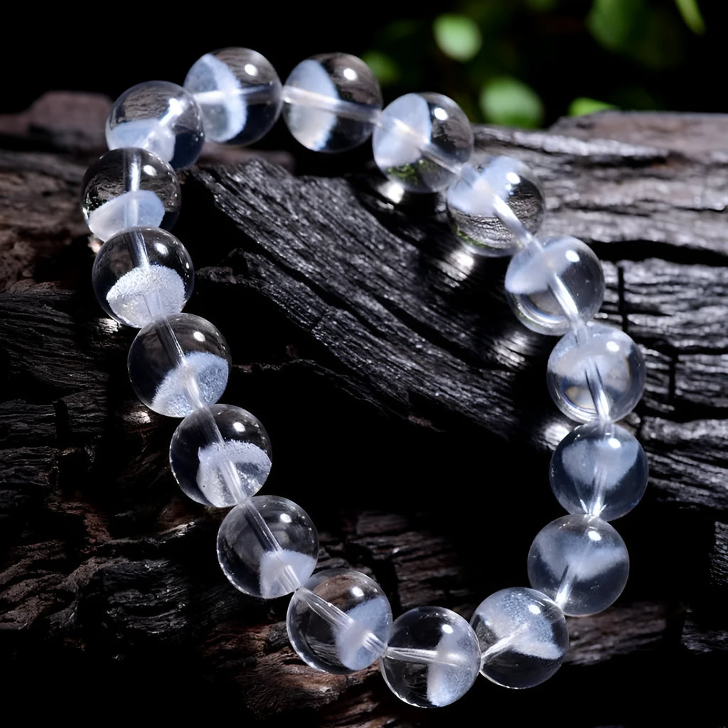 Women's original design white crystal pyramid bracelet with Ruyi charm on wrist.