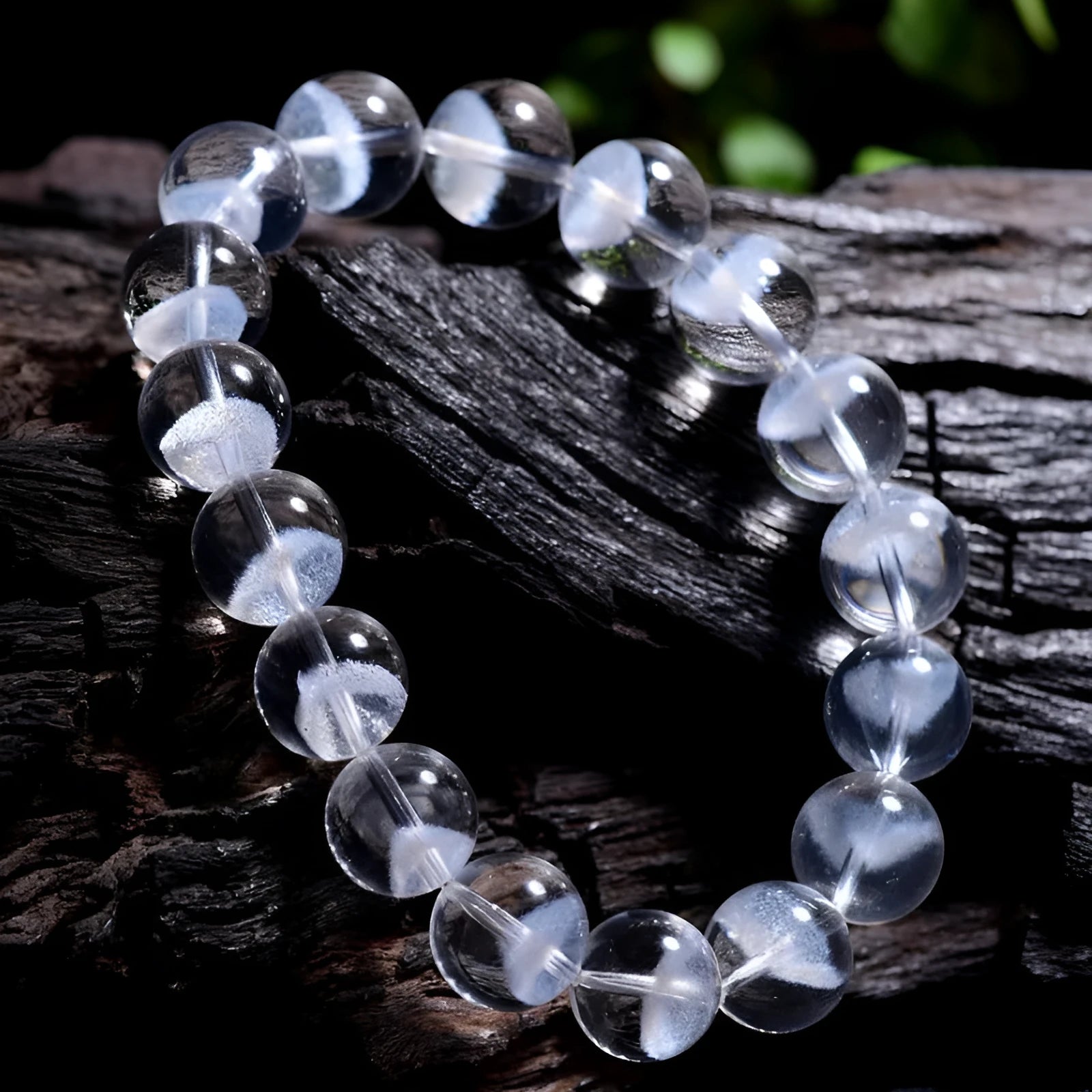Women's original design white crystal pyramid bracelet with Ruyi charm on wrist.