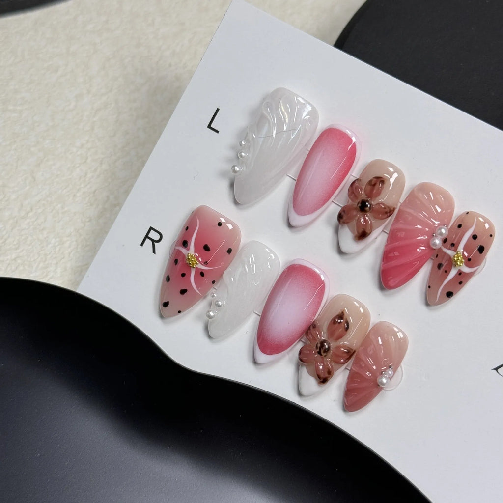 Three-dimensional carved nail art patches with hand-painted designs for almond-shaped nails