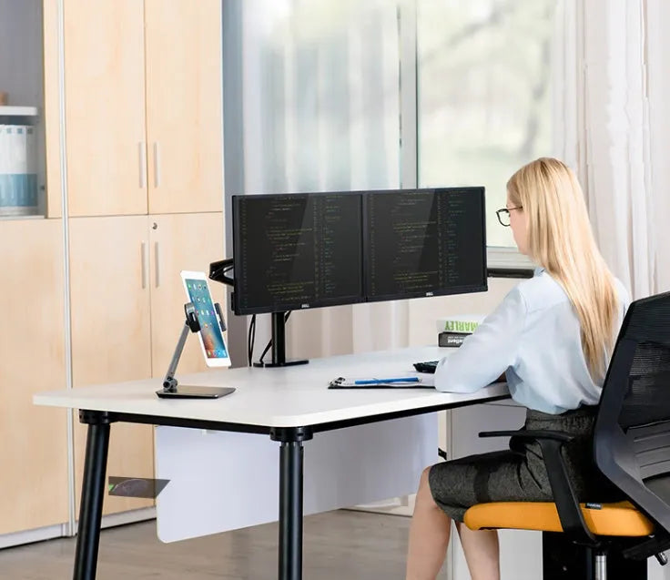 Black folding phone tablet holder with 360° rotating head on desktop