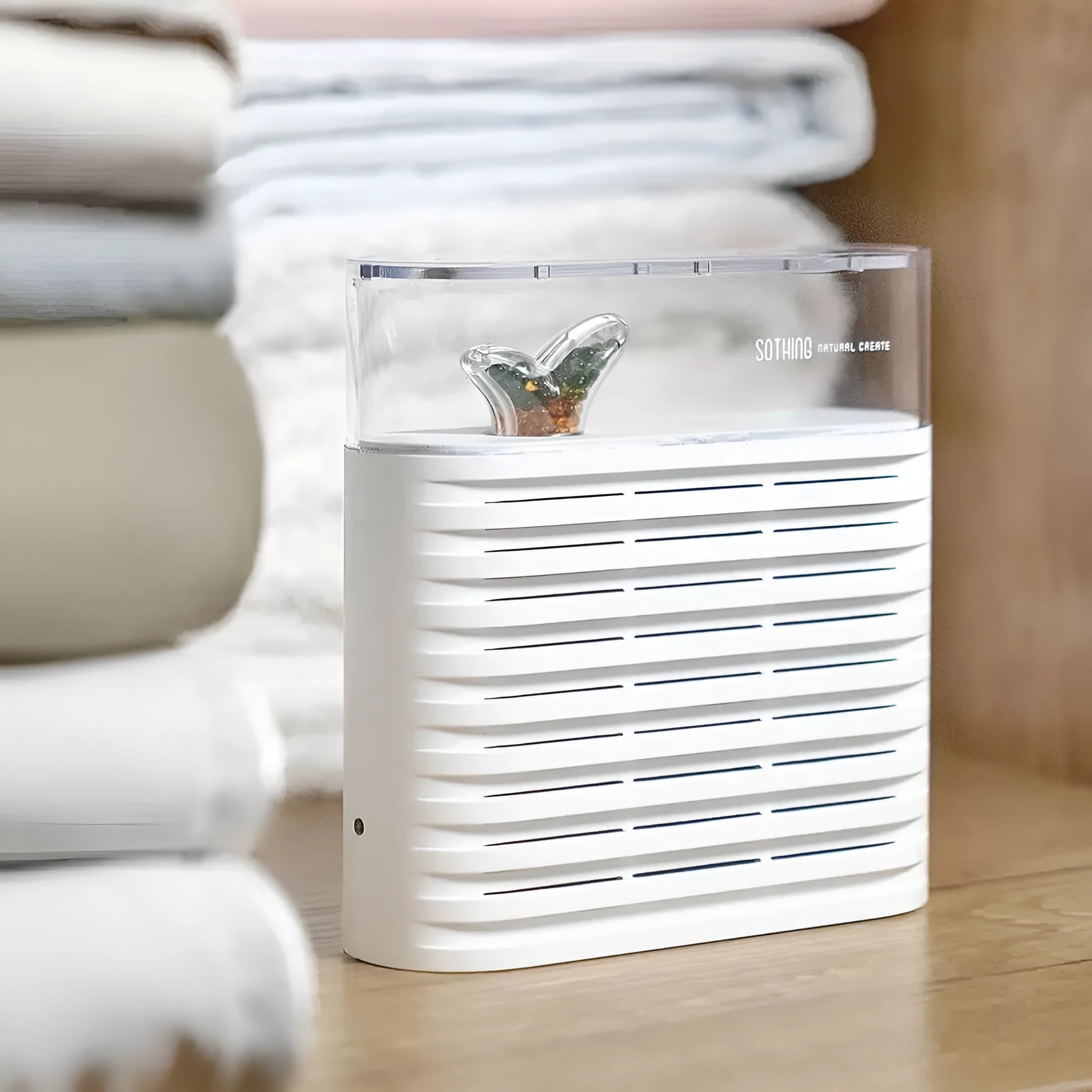 White recyclable cabinet dehumidifier box with transparent top showing orange silica gel beads