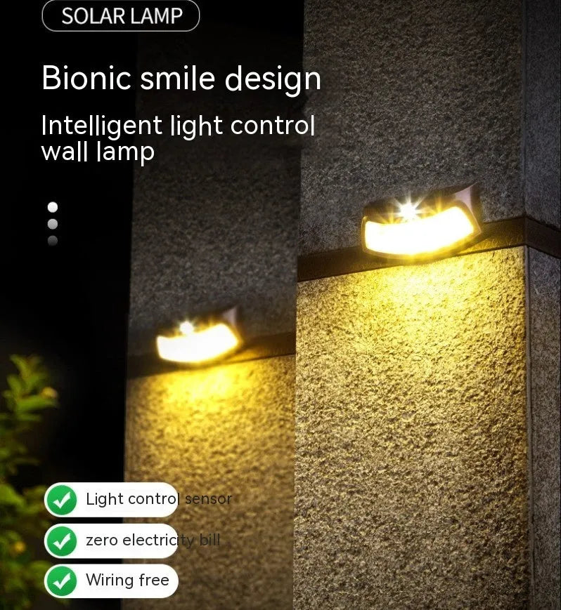 Solar outdoor wall lamp with smiling face design for garden courtyard lighting