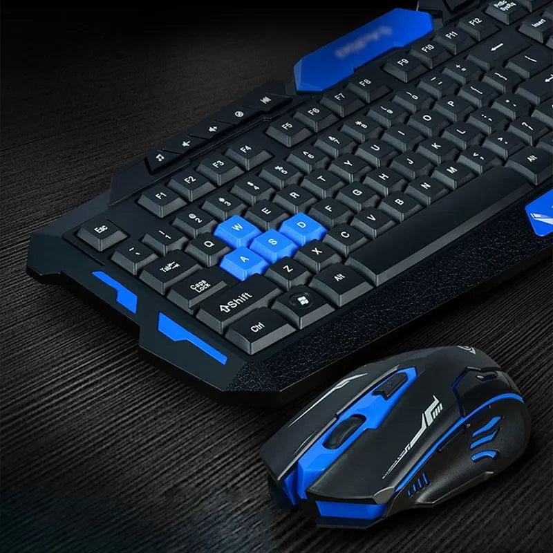 Black and blue wireless keyboard and mouse set on a desk, showing their size and design.