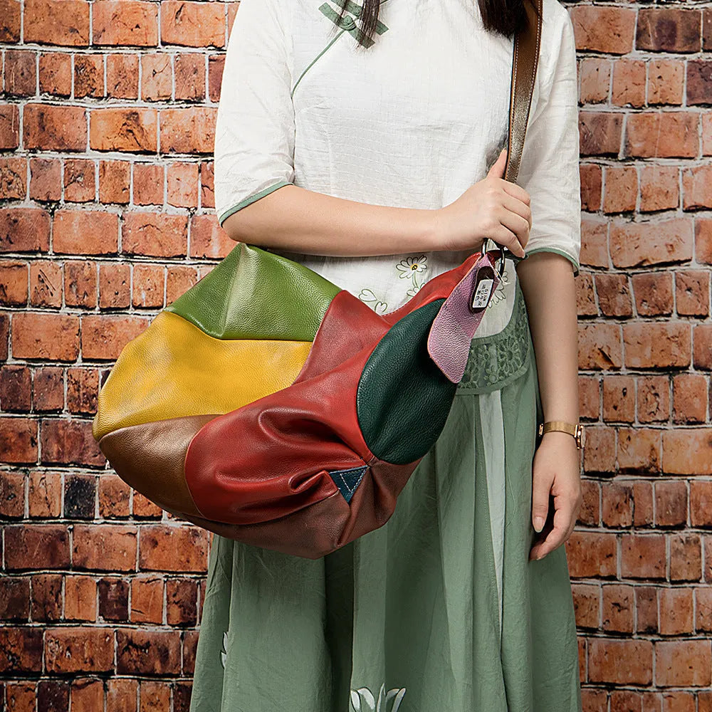 Genuine cowhide leather stitching rubbing travel bag shown in picture colour, featuring crossbody strap.