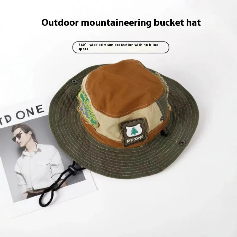 Army green women's foldable cotton fisherman hat with retro patchwork design and flat crown.