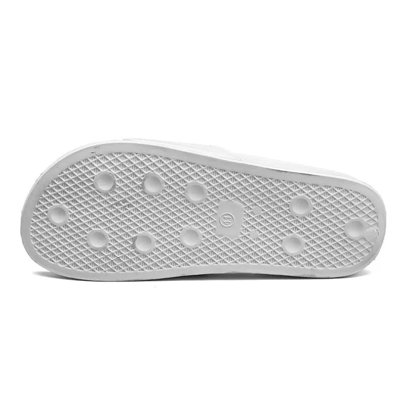 Men's black open-toe slippers with a rubber sole and viscose upper, shown next to a white pair.