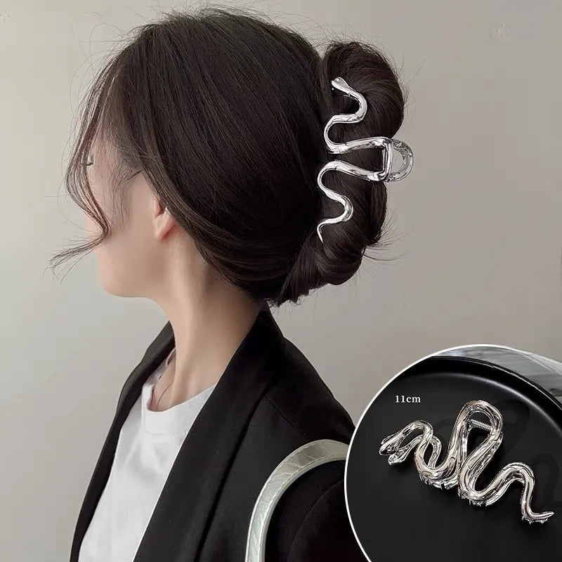 Slytherin serpentine metal hair barrette in silver or gun black finish measuring 10.5cm