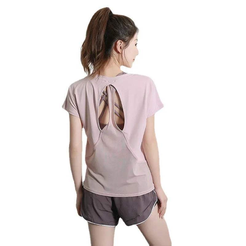 Women's polyester sports t-shirt in pink colour with short sleeves for yoga and running activities