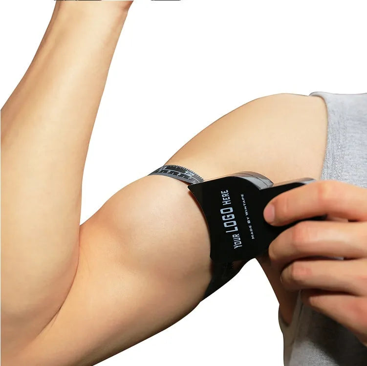 Black body fat measuring caliper instrument with measurement scale and cord