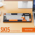 SK15 wired mechanical gaming keyboard with control knob in Autumn Water Blue colour on a desk.