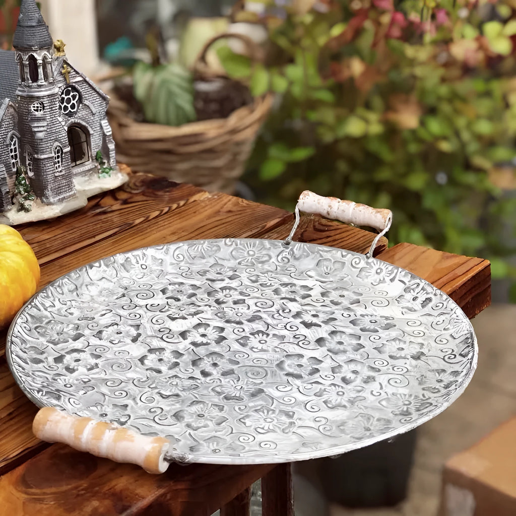 Round wrought iron belt-style storage tray shown in two available sizes.