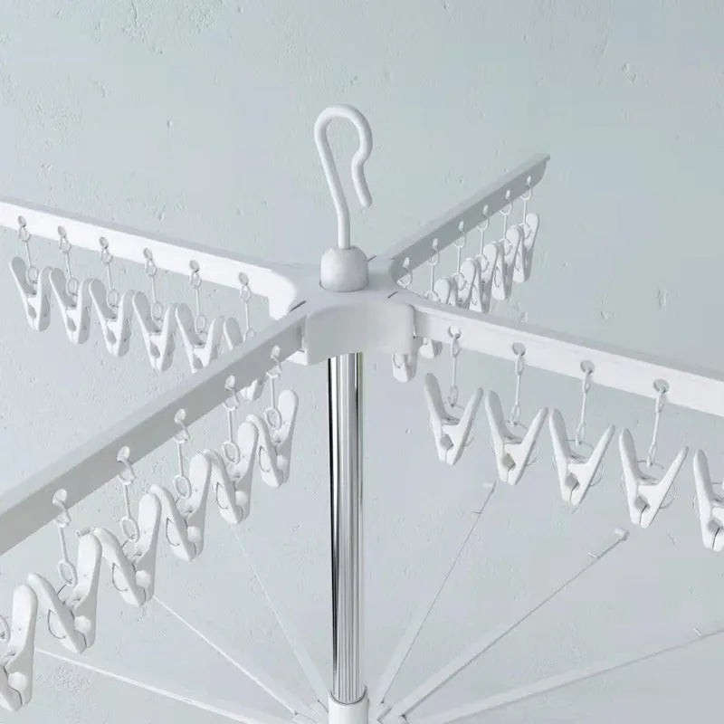 Stainless steel three-layer drying rack with movable plastic clips for laundry organisation