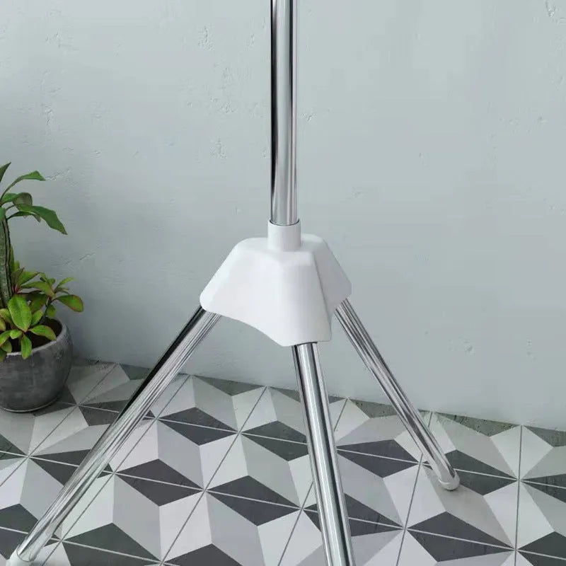 Stainless steel three-layer drying rack with movable plastic clips for laundry organisation