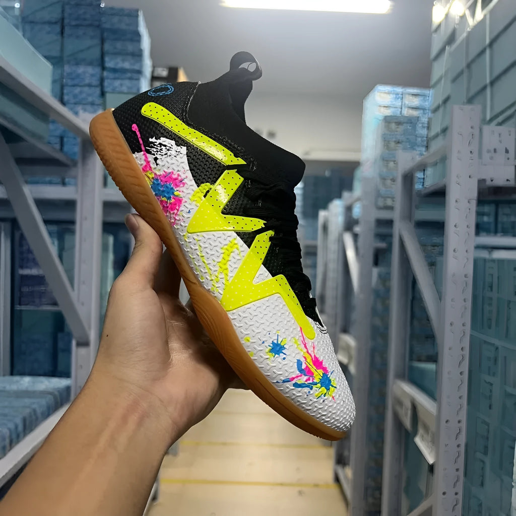 Football boots with removable moulded studs in black and yellow colour option