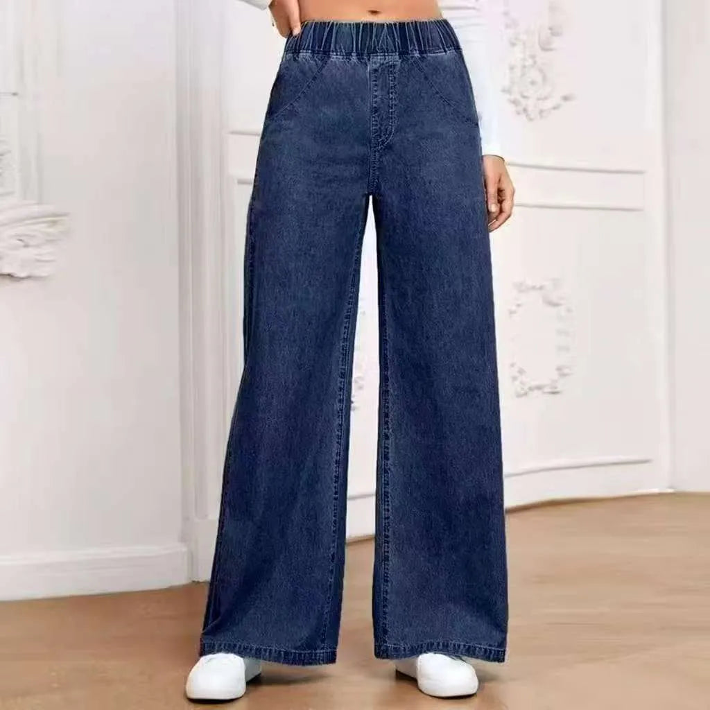 Light blue washed wide-leg straight cut jeans with mid-waist fit and zip fly opening