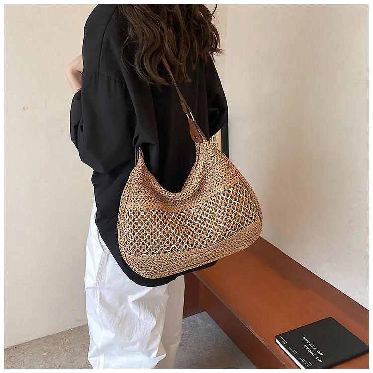 Women's khaki straw cross body bag with horizontal square shape and sandwich pocket.