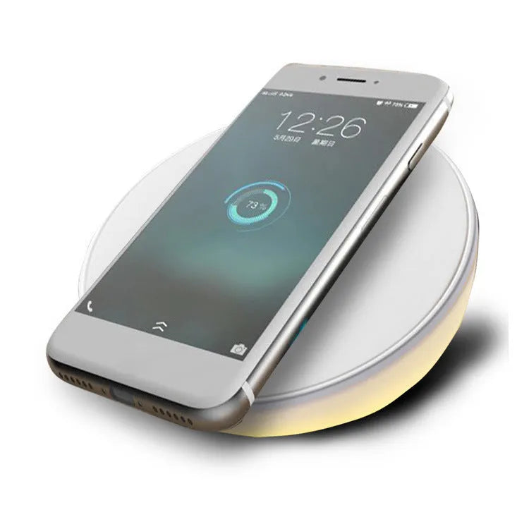 White wireless phone charger with digital clock display and three control buttons