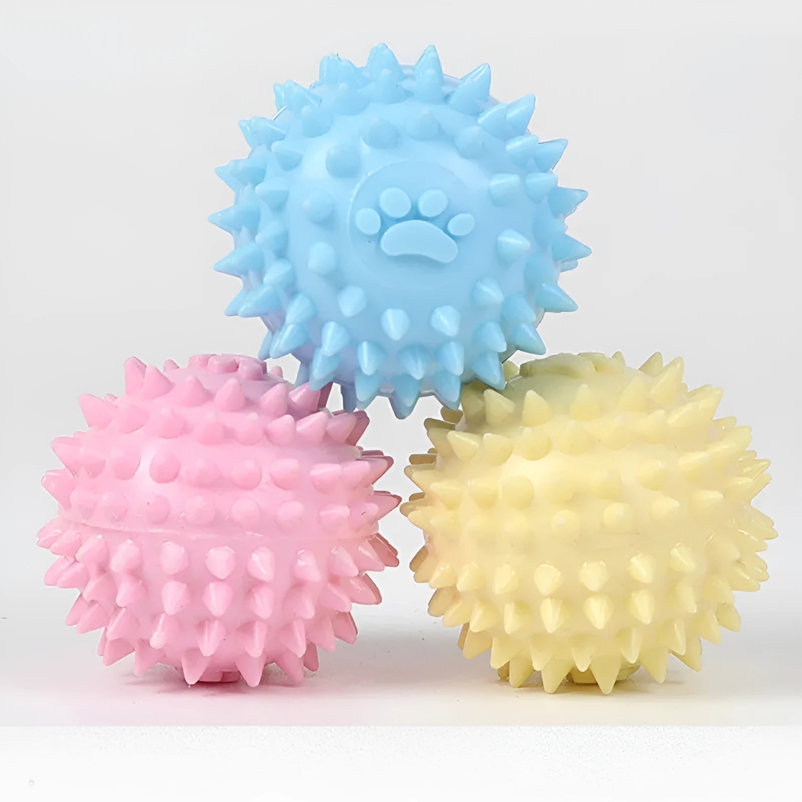6cm diameter blue TPR pet chewing ball with textured sides for dental cleaning