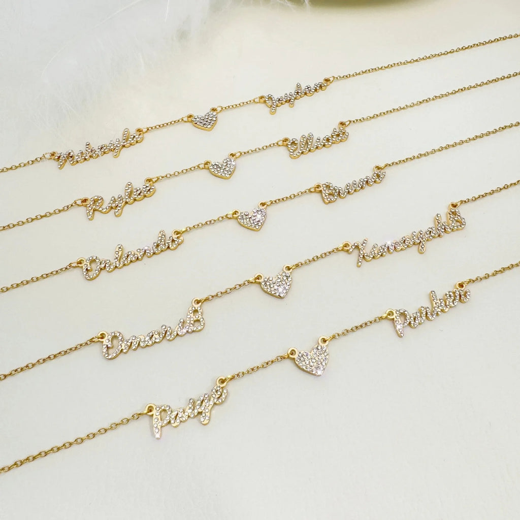 Customised diamond inlaid multi name necklace on stainless steel O-shaped chain, gold finish, with heart charms